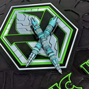 Heretic Knives Thoth Titanium in TURQUOISE Cel Shade H038-CS-TQ pens on neon logo background