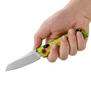 Close-up of green and red splatter handle of OKnife XEN Zombie Rail Lock Folding Knife