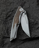 Bestech Togatta BT2102D side view – dark grey titanium + green canvas micarta inlay handle