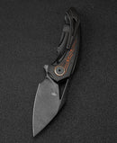 Bestech Nuke BT2107E closed view – 4.05 inch closed, black titanium frame with orange G10 inlays