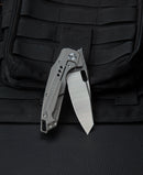 Bestech Nyxie BT2209C side view – grey titanium handle with carbon fiber inlay and ceramic ball bearings