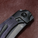Kansept Pluto K3129A2 open position showing blackwash titanium and purple micarta