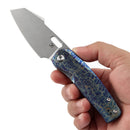 Kansept Orlok K2111A3 pocket knife with lightning strike titanium handle in hand