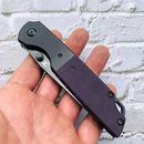 Closed Kansept Warrior T1005S6 with purple G10 handle and liner lock mechanism