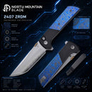 North Mountain Blade 2407-ZRDM folding knife fully open showing tanto blade and titanium damascus handle inlays