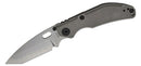 Closed titanium folding knife with textured handle