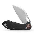 Close-up of textured black G10 handle and sheepfoot blade of TRIVISA lock knife